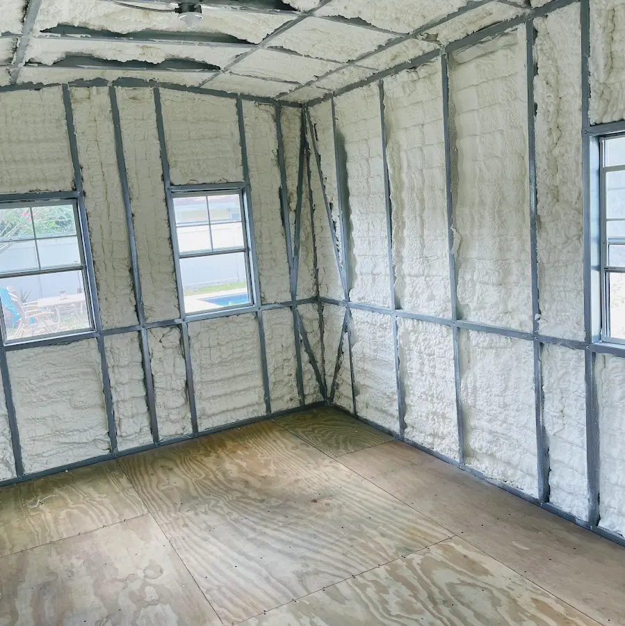 Closed-cell spray foam insulation applied to wall cavities in a residential project in Charlestown